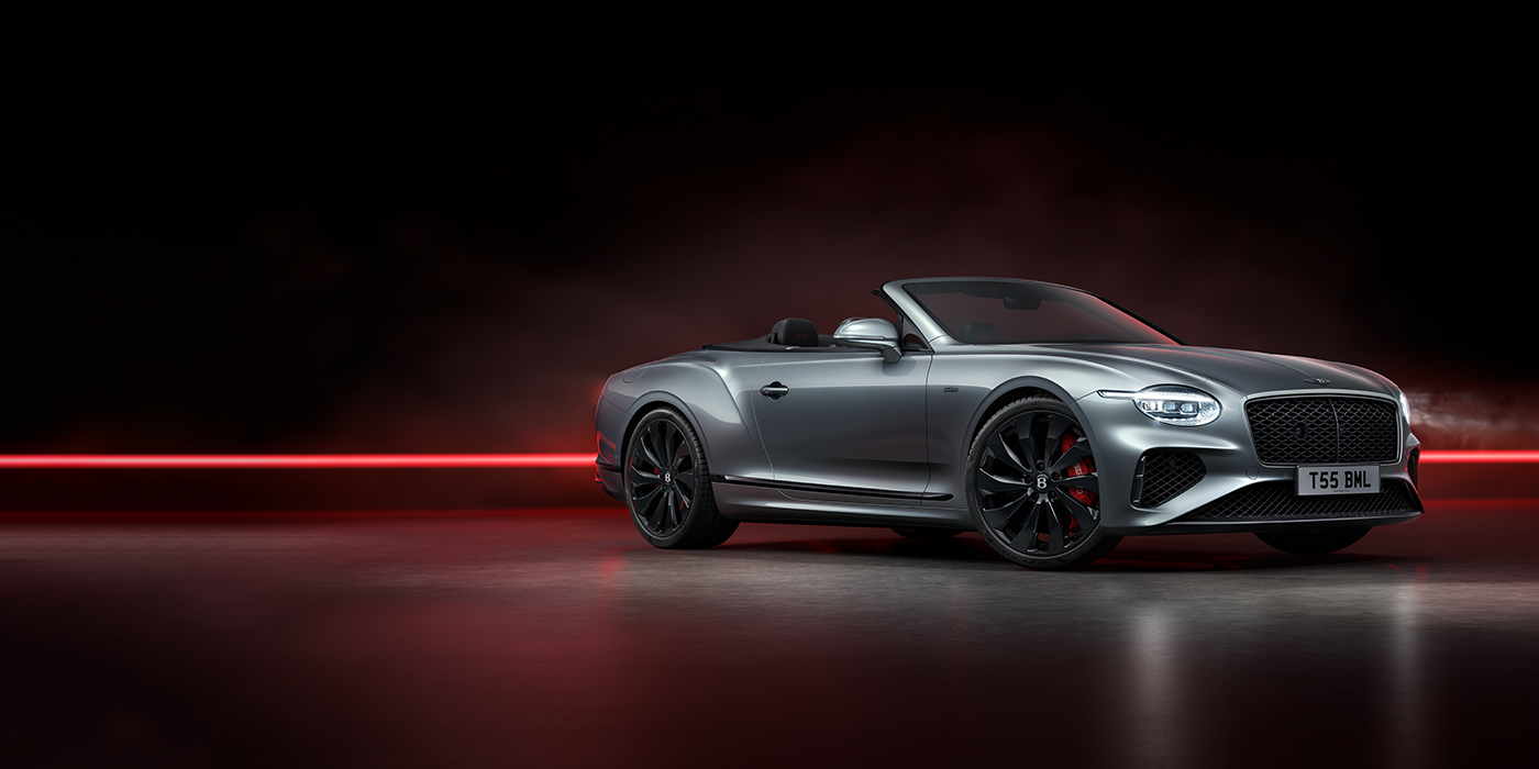Bentley Monaco Bentley Continental GTC Black Edition convertible front three quarters in Hallmark silver against a dark grey and red background