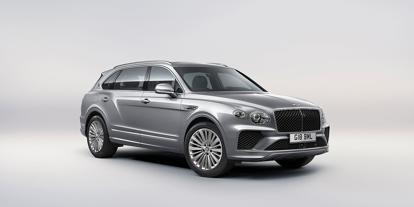 Bentley Monaco Bentley Bentayga Extended Wheelbase luxury SUV front three quarter view in Moonbeam paint with 21 inch five spoke painted wheels