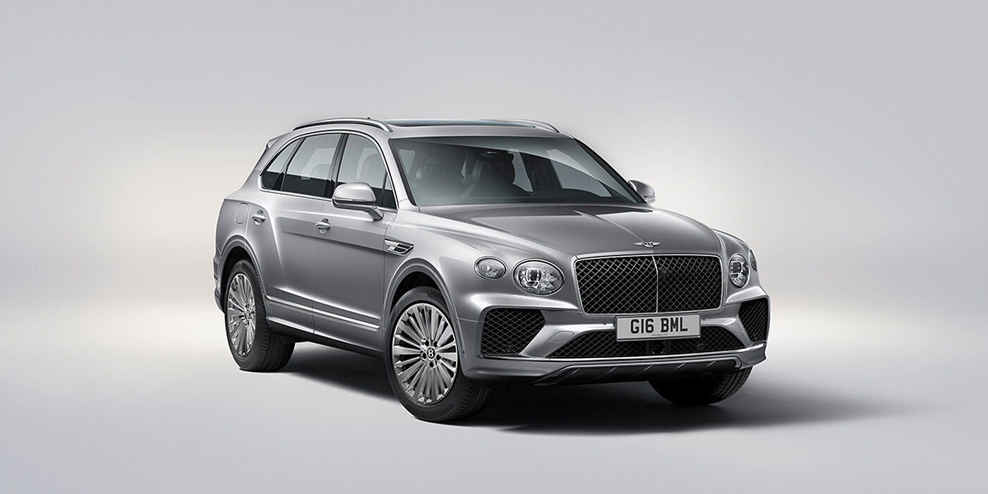 Bentley Monaco Bentley Bentayga luxury SUV front three quarter view in Moonbeam paint with matrix grille and 21″ 5 spoke painted wheels
