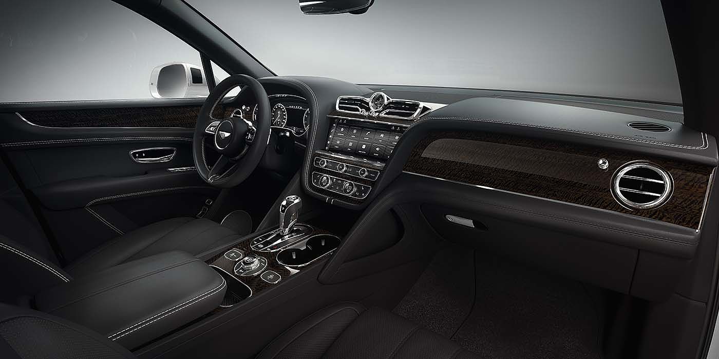 Bentley Monaco Bentley Bentayga EWB SUV front interior in Beluga black leather and Dark Fiddleback Eucalyuptus veneer
