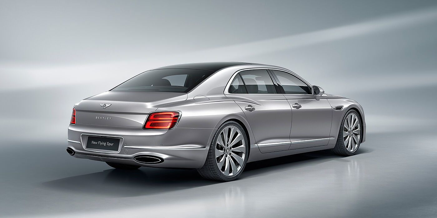 Bentley Monaco New Bentley Flying Spur sedan rear view in Silverlake paint with ten spoke wheels and chrome matrix grille