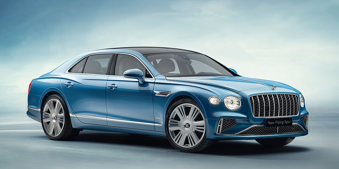 Bentley Monaco New Bentley Flying Spur Azure sedan front view in Light windsor blue by Mulliner paint with 22 inch Azure wheels and chrome exterior details