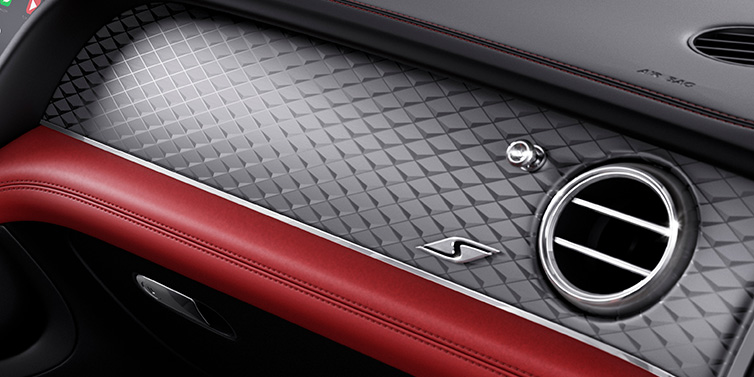 Bentley Monaco Bentley Bentayga S SUV front interior dash with Dark Tint Diamond Brushed Aluminium veneer and S badge surrounded by Hotspur red and Beluga black hide