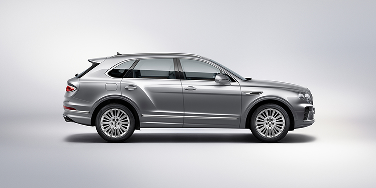 Bentley Monaco Bentley Bentayga SUV side profile in Moonbeam silver paint against white background featuring 21 inch 5 spoke wheels