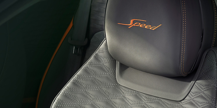 Bentley Monaco Bentley Continental GT Speed coupe seat detail in Gravity Grey hide and Speed emblem in Mandarin by Mulliner coloured embroidery