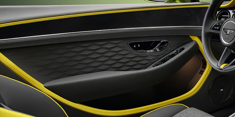 Bentley Monaco Bentley Continental GTC Speed convertible interior door details featuring Gravity Grey and Cyber Yellow by Mulliner hides and high gloss carbon fibre veneer