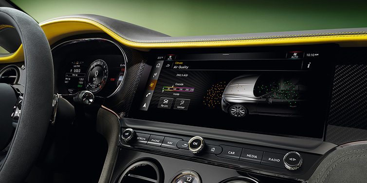 Bentley Monaco Bentley Continental GTC Speed convertible front interior centre console with MMI screen showing Air Quality visualisation surrounded by Cyber Yellow by Mulliner and Gravity Grey hides and high gloss carbon fibre veneer